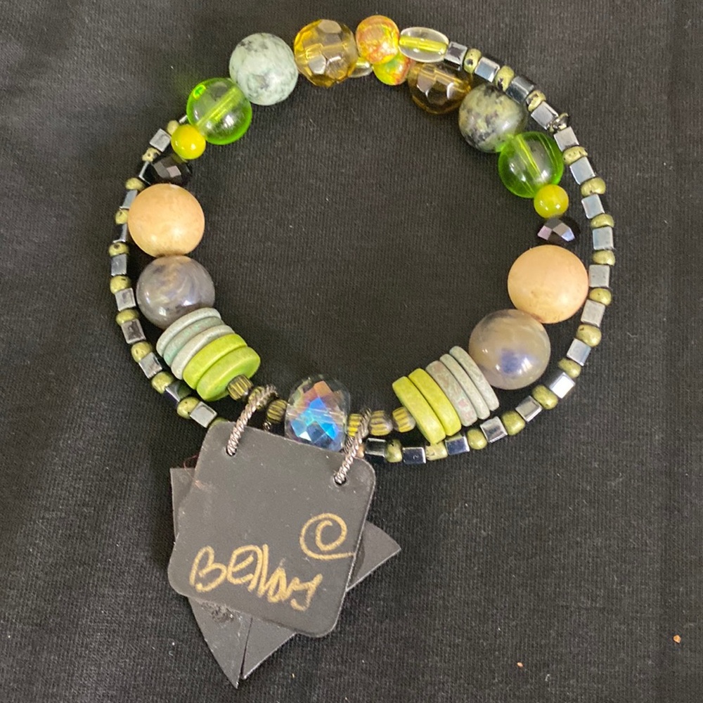 FUNKY BRACELET that is flexible on your wrist.  Wood & glass beads.